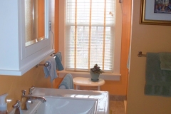 Recently updated bathroom with pedestal sink, large shower and great view of the river.